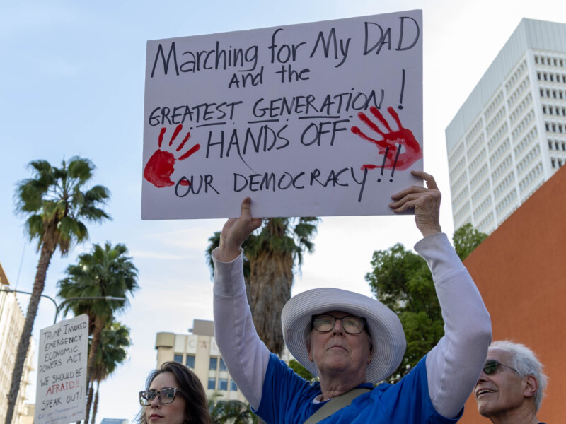 4/5/25 - Los Angeles, Calif: Signs flooded Downtown Los Angeles as thousands of people protests President Trump and Elon Musk on April 5. Protestors walked from Pershing Square up to the Los Angeles City Hall. Photo credit: Samuel Chacko