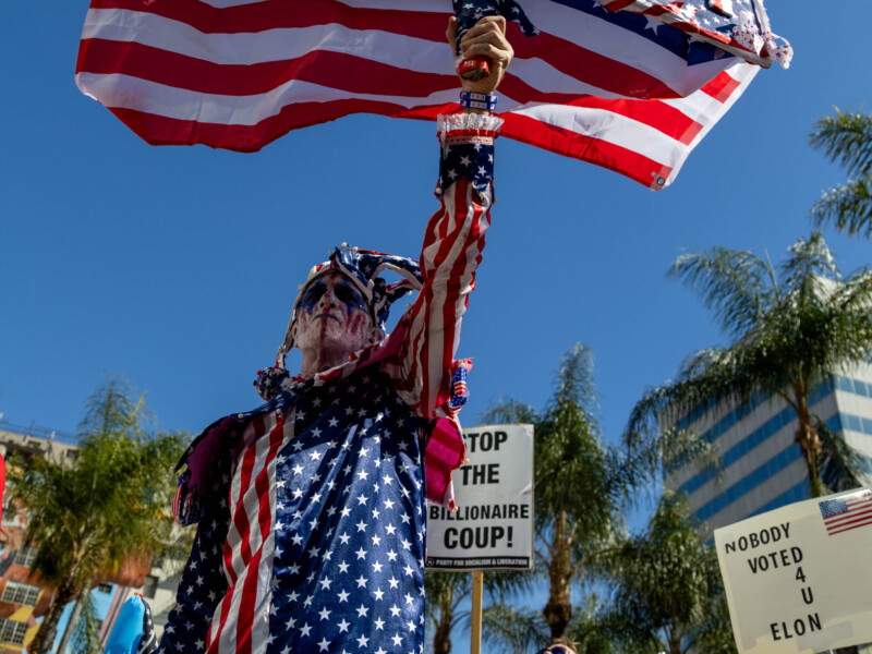 4/5/25 - Los Angeles, Calif: A few protestors wore red, white and blue with one dressing up as lady liberty during the "Hands Off" protest in Downtown Los Angeles on April 5. Photo credit: Samuel Chacko