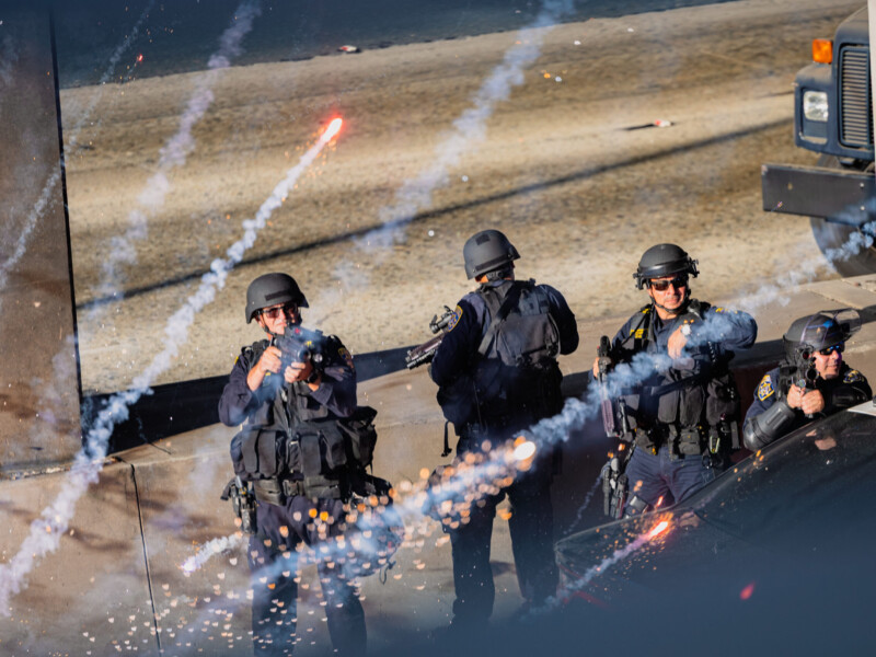 A firework explodes on the 101 Freeway as California Highway Patrol fire flash-bang grenades into the air to disperse protesters on June 8. The anti-ICE protest was declared an "unlawful assembly." Ethan Cohen | Long Beach Current