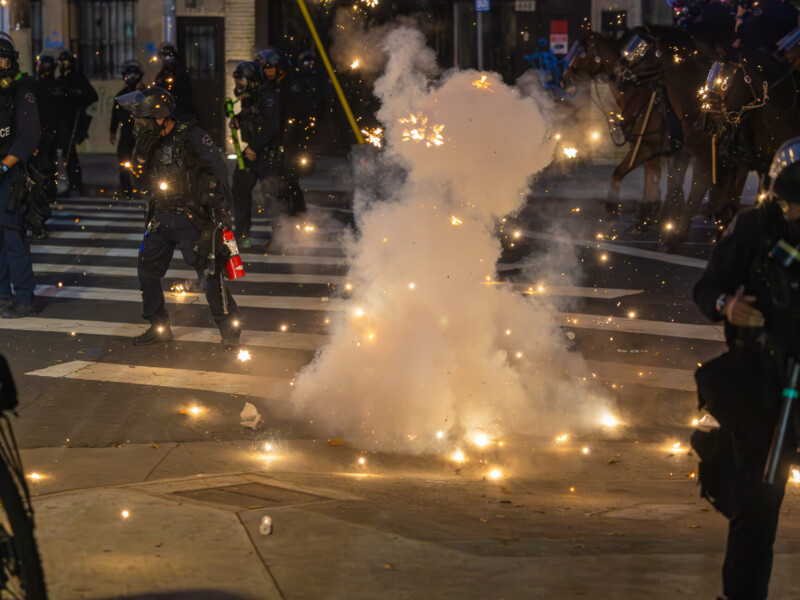 A firework explodes in the middle of a police line during anti-ICE protests in downtown Los Angeles on June 8. Ethan Cohen | Long Beach Current