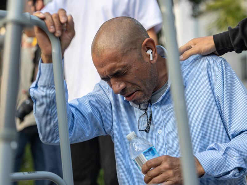 Los Angeles resident Alfredo Flores, 51, chokes on tear gas after attempting to quell protesters clashing with police in downtown Los Angeles on June 8. Tear gas is designed to temporarily incapacitate individuals by causing irritation to the eyes, nose, mouth, throat, lungs and skin. Ethan Cohen | Long Beach Current