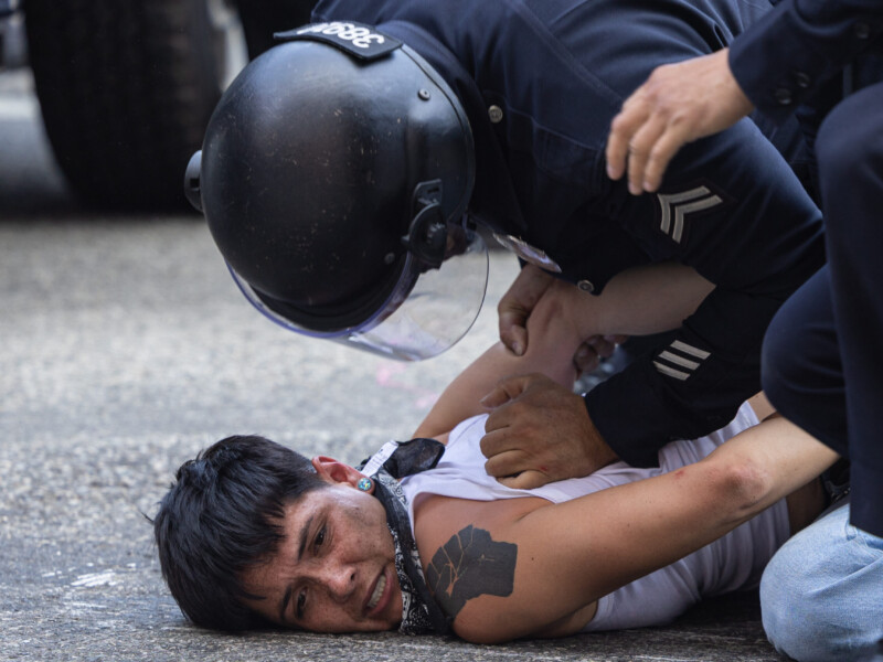 A police officer slams a protester into the ground and screams at them after being detained during protests on Temple and Alameda Streets in downtown Los Angeles on June 8. Ethan Cohen | Long Beach Current